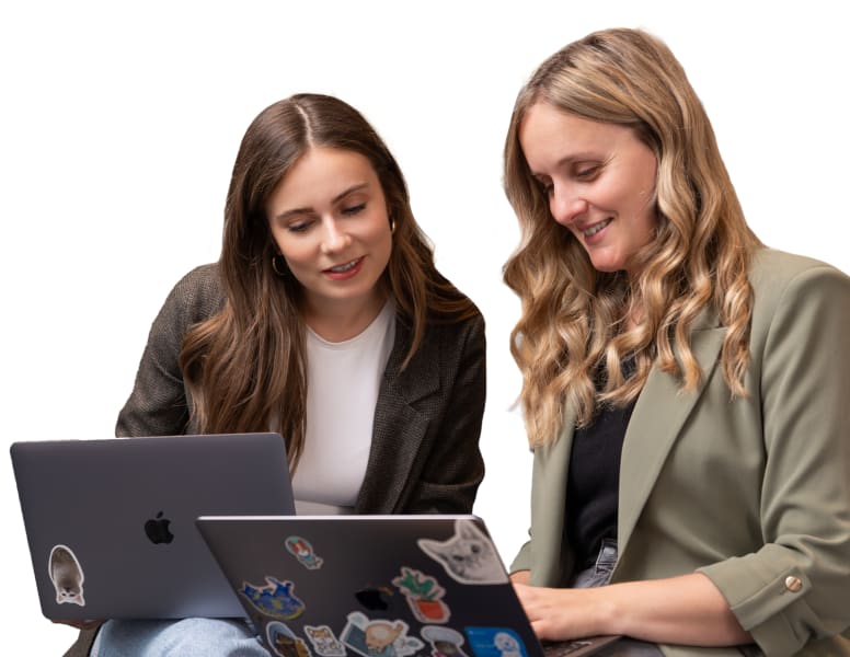 two people from Tractive working together on notebooks